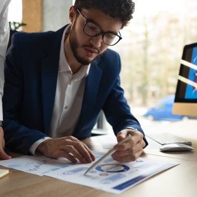 people-analyzing-checking-finance-graphs-office